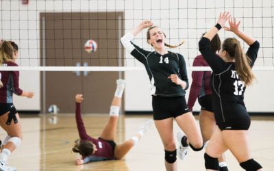 team of women competing atvolleyball