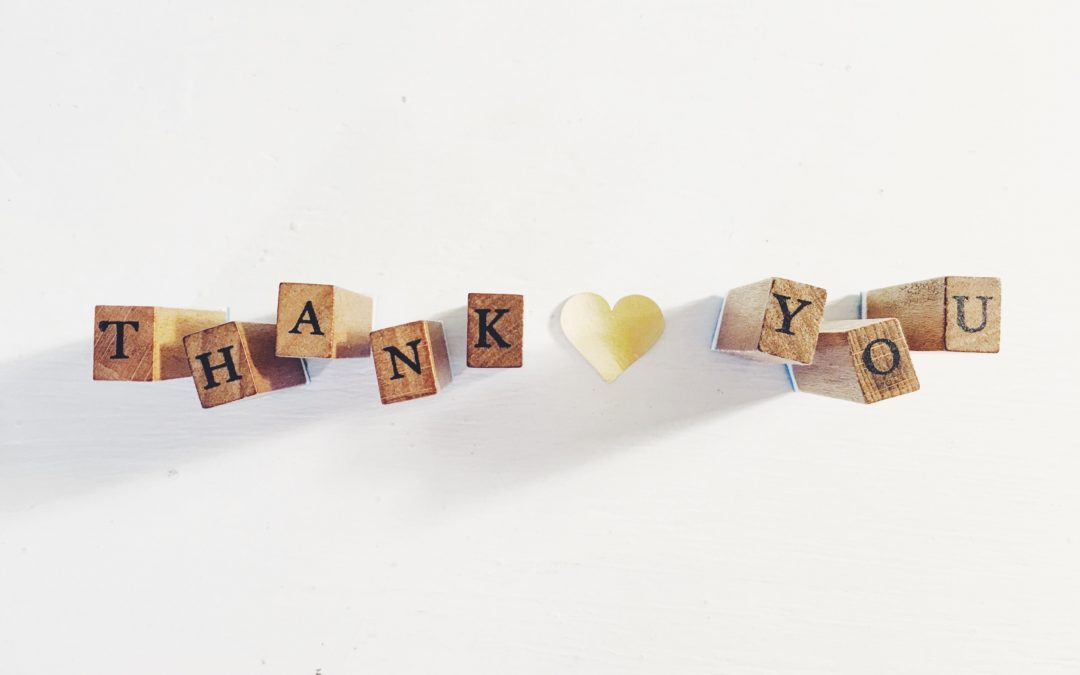 Wooden blocks that spell the words "Thank you"